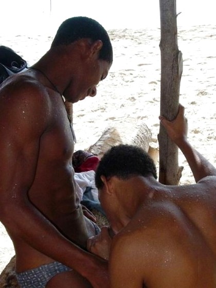 Sexy black twinks fucking bareback on the beach.